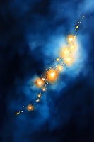 Glowing magical lights floating diagonally across deep blue night sky background with sparkling particles and luminous ethereal effect, creating mystical atmosphere.