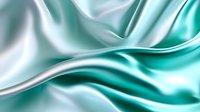 Luxurious turquoise and white silk fabric with gentle folds and waves creates elegant flowing texture for fashion and luxury backgrounds.