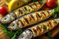 Grilled whole fish with herbs and vegetables on wooden cutting board for healthy Mediterranean cuisine and seafood cooking recipes.
