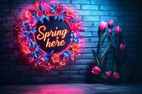 Glowing neon spring wreath with pink and blue flowers against brick wall, illuminated tulips casting vibrant reflections in moody atmosphere.