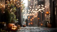 Atmospheric cobblestone alley decorated for Halloween with glowing jack-o'-lantern pumpkins and twinkling fairy lights creating magical autumn ambiance.