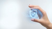 Hand protecting digital shield with checkmark symbol representing cybersecurity data protection and online safety technology concept.