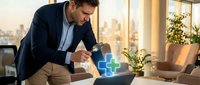 Professional businessman in suit working on laptop with digital healthcare cross symbol in modern office environment for medical technology presentations.