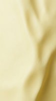 Soft cream-colored fabric with gentle folds and natural texture, suitable for backgrounds, textile design, fashion, home decor, and luxury product presentations.