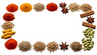 Colorful spice frame border with paprika, turmeric, cumin, star anise, cinnamon sticks and cardamom pods arranged on white background for culinary design.