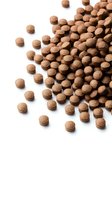 Chocolate cereal balls scattered on white background, crunchy breakfast food isolated for packaging and advertising design.