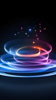 Glowing spiral light trails in blue and pink neon colors against dark background with floating luminous particles create dynamic motion effect.