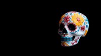Decorative sugar skull with colorful floral pattern on white background featuring orange and red flowers against dark backdrop. Traditional Mexican folk art design.