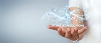 Professional businessman holding digital holographic legal scales with secure legal solutions text floating above palm in modern technology concept.