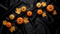 Autumn pumpkins and golden maple leaves arranged on dark fabric background for seasonal harvest decoration and fall holiday design projects.