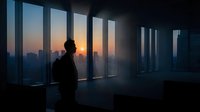Business professional silhouette standing by floor-to-ceiling windows overlooking city skyline at sunset, modern office interior with dramatic lighting.