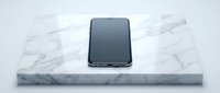 Smartphone with dark screen displayed on white marble platform, isolated on white background for product showcase and design mockup use.