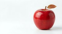 Fresh red apple with brown leaf on white background isolated for healthy eating and nutrition concepts.
