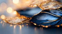 Shimmering gold and navy blue leaves with water drops and bokeh lights create magical macro nature composition against dark background with soft focus effect.