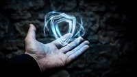 Digital security shield hologram floating above open palm representing cybersecurity protection and data safety in modern technology concept.