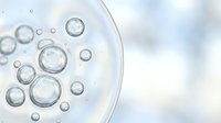 Transparent water bubbles and foam floating on white surface, representing cleansing, skincare, cosmetics, and wellness product applications.