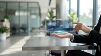 Professional businesswoman presenting holographic data visualization technology in modern office environment for digital transformation and innovation concepts.