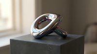 Polished chrome sculptural ring displayed on dark stone pedestal, contemporary art object with reflective metallic surface and organic curved form.