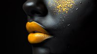 Close-up portrait of African woman with black skin art makeup, bright yellow lips and gold glitter particles on dark background, creative beauty concept.