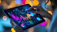 Female trader analyzing colorful stock market data on tablet with bokeh background, financial technology concept for investment decisions.