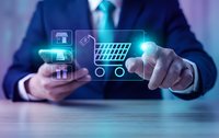Professional businessman in dark suit using smartphone while interacting with glowing digital commerce icons including shopping cart and store symbols.