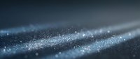 Abstract blue glitter particles flowing in elegant waves with bokeh light effects and sparkling dust creating magical atmosphere for luxury backgrounds.