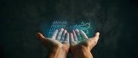 Hands holding glowing digital circuit board with data streams and technology symbols, representing innovation, connectivity, and future tech solutions for business applications.