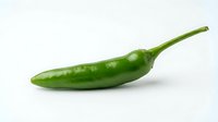 Green chili pepper isolated on white background, ready for culinary, food packaging, and recipe design projects.