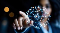 Businessman touching virtual network sphere with glowing blue dots and connections, digital transformation concept on dark background with bokeh lights.