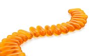 Orange supplement capsules arranged in curved line on white background isolated for health and wellness design projects.