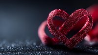Glittering red heart-shaped ribbon on dark sparkly surface creates romantic mood with soft bokeh effect and copy space for Valentine's day message or love concept.