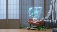 Holographic liver projection floating above open palm in modern medical office setting for healthcare technology and organ health visualization.
