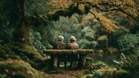 Elderly couple sitting together on wooden bench in peaceful autumn forest surrounded by golden foliage and moss-covered trees creating romantic nature scene.