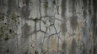 Weathered concrete wall with deep cracks and peeling paint showing age and deterioration. Grunge texture background for industrial design projects.