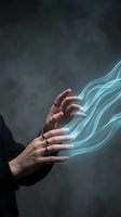 Human hands with glowing blue energy streams flowing from fingertips against dark smoky background for digital technology and magic concepts.