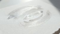 White cream cosmetic texture smear on clean surface showing smooth application and skincare product consistency for beauty and wellness concepts.