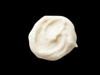 Creamy white dollop of sour cream, yogurt, or whipped cream isolated on transparent background. Ready for design use on packaging, menus, recipe graphics, and food product marketing materials.