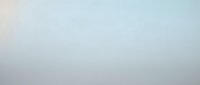 Soft gradient background transitioning from warm beige to cool blue creating serene atmospheric effect for presentations and design projects.