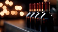 Row of red wine bottles against blurred warm bokeh lights creating elegant atmosphere for wine tasting, restaurant menu, or beverage marketing.