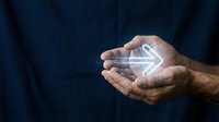 Man holding glowing arrow pointing right, symbolizing forward direction, progress, and digital transformation for business growth and future planning concepts.