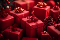 Red wrapped Christmas presents with glittery bows and ribbons arranged with pine cones creating festive holiday composition against dark background.
