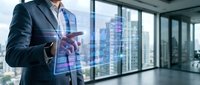 Professional businessman using holographic digital interface technology in modern office with city skyline view through floor-to-ceiling windows.