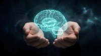 Hands holding glowing digital brain hologram representing artificial intelligence, neuroscience, mental health, innovation and futuristic technology concepts.