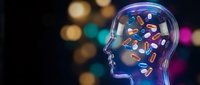 Transparent human head profile with colorful pills and capsules inside brain area representing pharmaceutical medicine and mental health treatment.