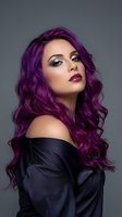 Young woman with vibrant purple curly hair and dramatic makeup wearing black off-shoulder top against gray background for beauty and fashion concepts.