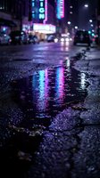 Wet urban street at night with neon signs reflecting in puddles, creating vibrant cyan and magenta light patterns on asphalt for cyberpunk and modern city concepts.