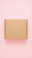 Closed kraft cardboard shipping box with metal fasteners on pink background, ready for packaging, delivery, and e-commerce design projects.
