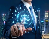 Professional businessman touching digital justice scales hologram with network connections over city skyline at night for legal technology concepts.