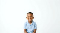 Young boy with dark skin tone and short hair wearing light blue polo shirt, smiling at camera against white background. Isolated portrait suitable for educational materials, websites, and promotional content.