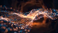 Glowing golden particles flow in dynamic waves across dark background, creating luminous trails of light and energy with bokeh effects.